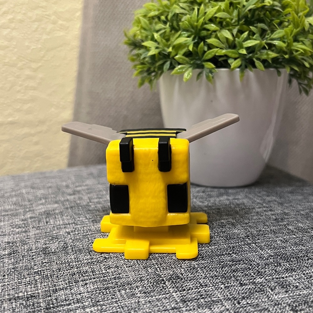 Yellow and Black Toy Figure